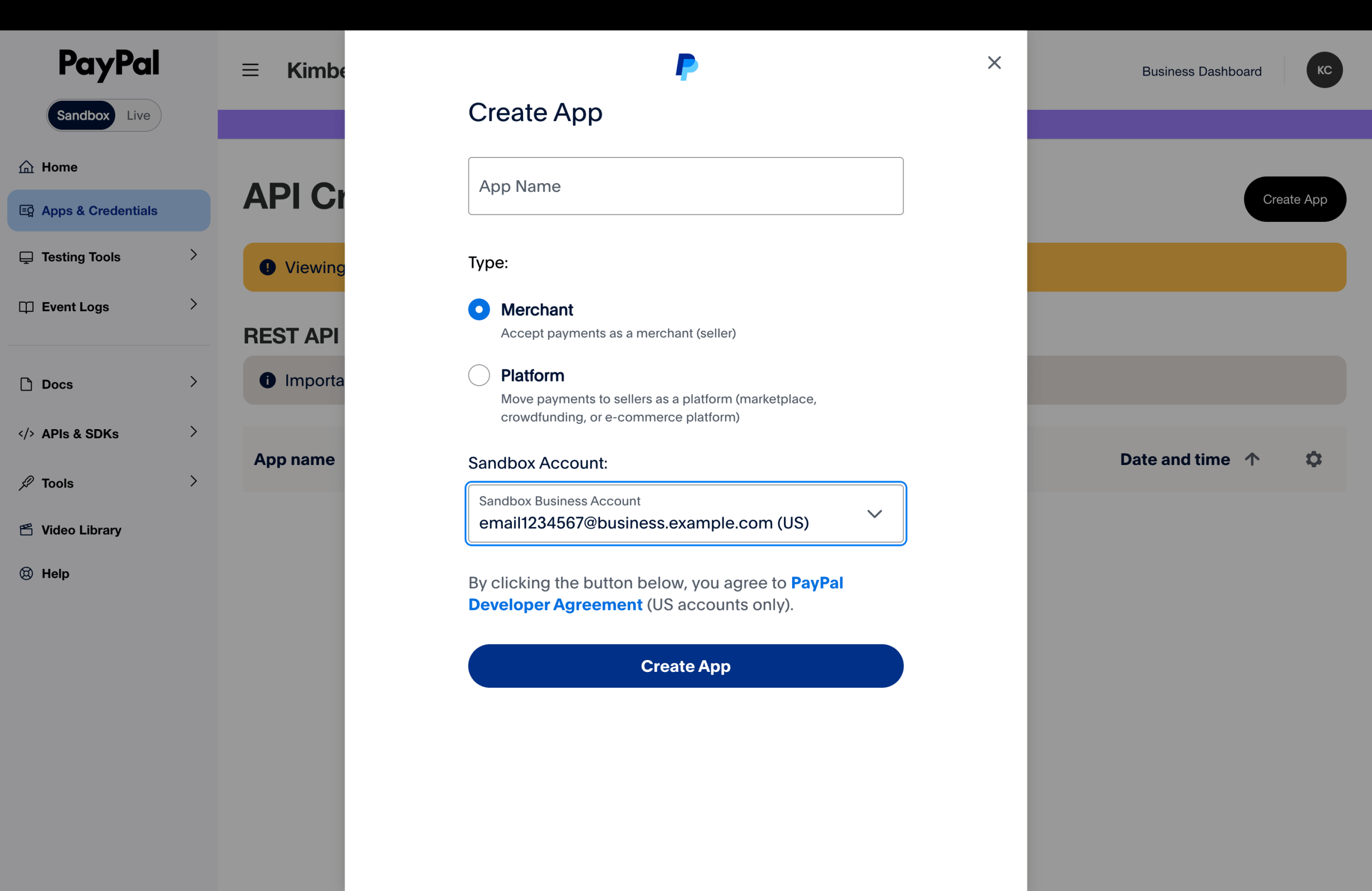 PayPal Developer Dashboard Create App dialog with an App Name field, Type options (Merchant selected, Platform available), a Sandbox Account dropdown, and a Create App button.