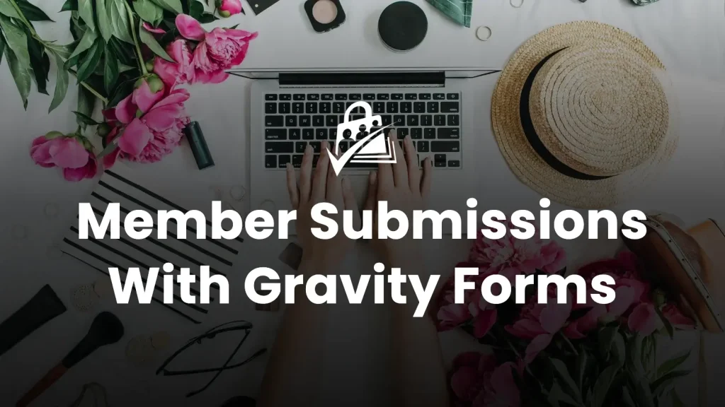 Banner image for the Member Submissions With Gravity Forms blog post — bold white headline reading "Member Submissions With Gravity Forms" centered over an overhead photo of hands typing on a laptop surrounded by pink peonies and desk accessories